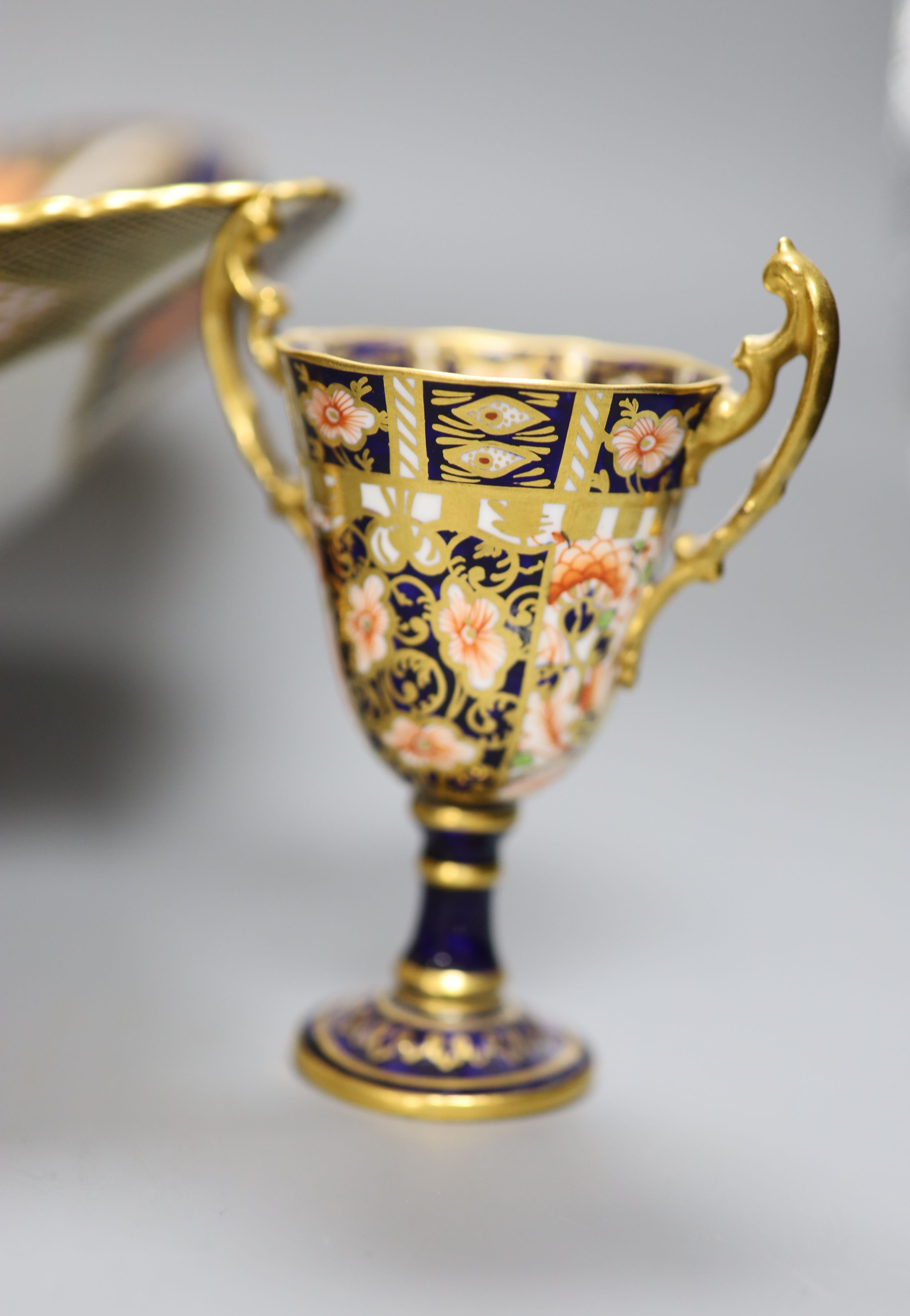 A Royal Crown Derby dish, a vase and a cup, tallest 30cm (all a.f.)